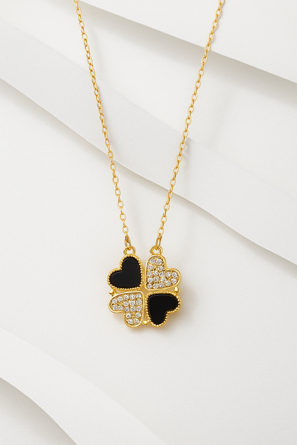 ANNAYA Gold-Plated 4 Leaf Heart Charm Necklace – Black Enamel & Crystal Design for Women